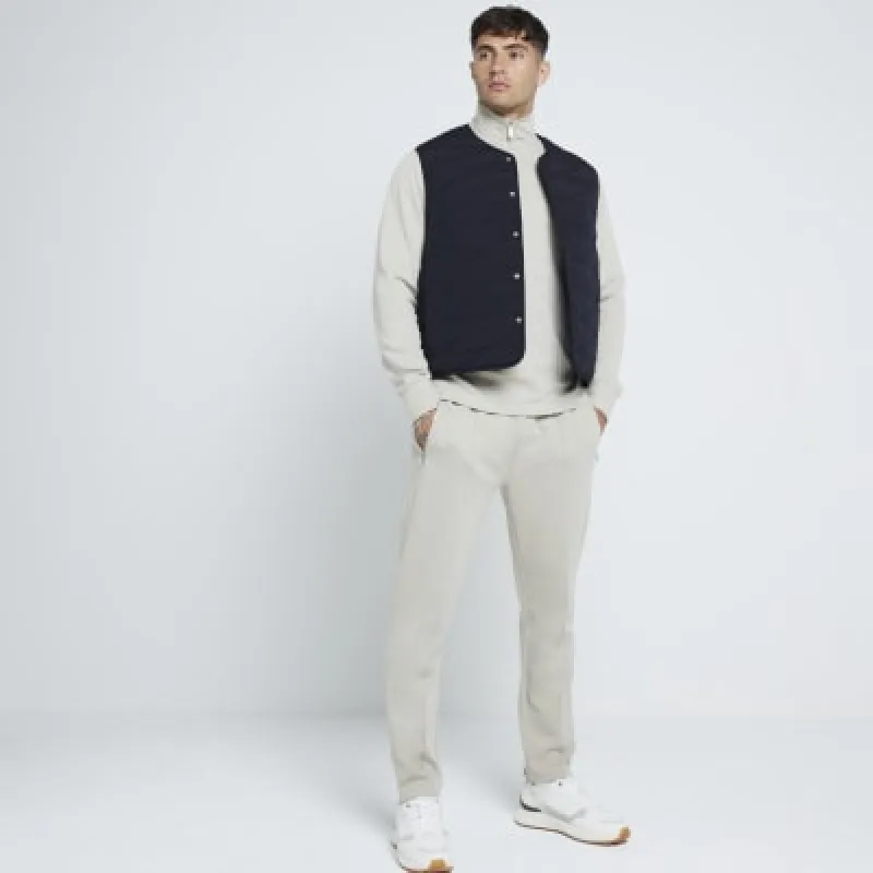 Stone slim fit stretch textured joggers sold by River Island