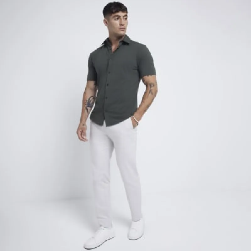 Khaki slim fit stretch short sleeve shirt sold by River Island
