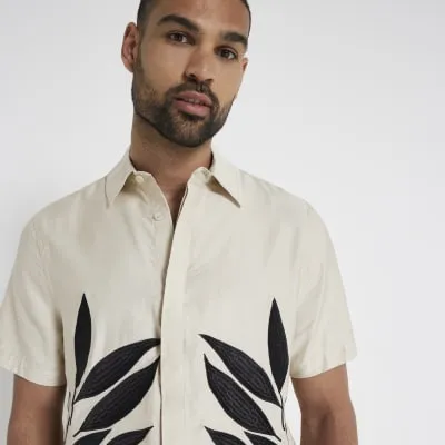 Stone regular fit leaf print shirt sold by River Island