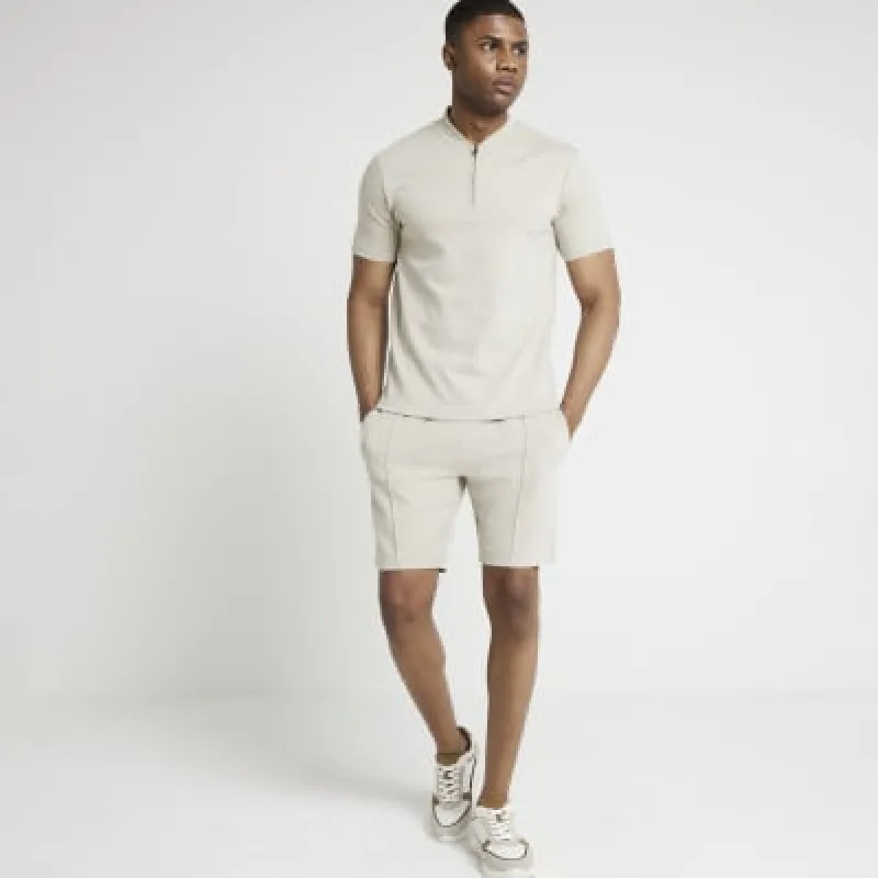 Stone slim fit textured shorts sold by River Island