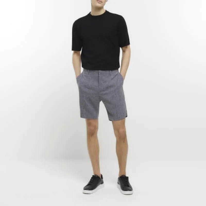 Navy slim fit textured smart shorts sold by River Island