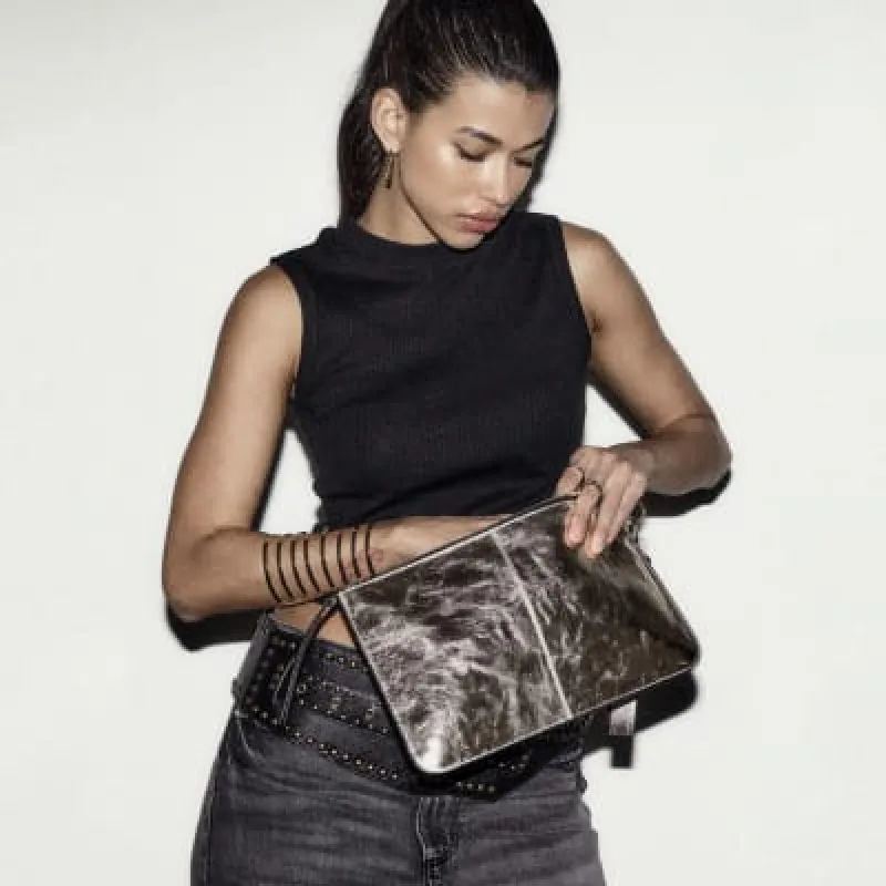 Gold metallic leather clutch bag sold by River Island