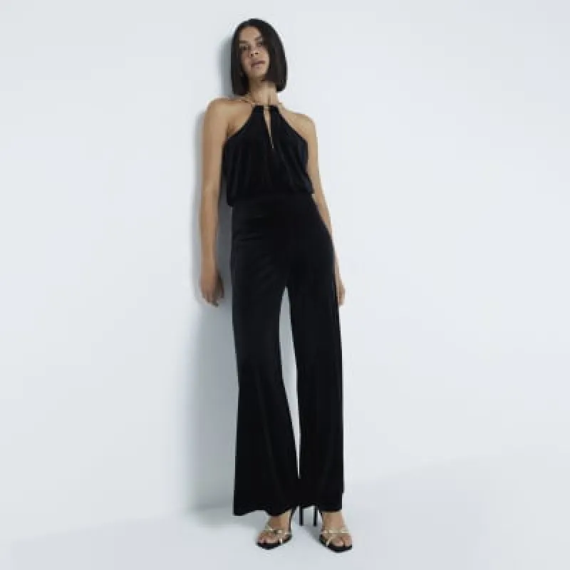 Black Velvet Halter Neck Jumpsuit sold by River Island