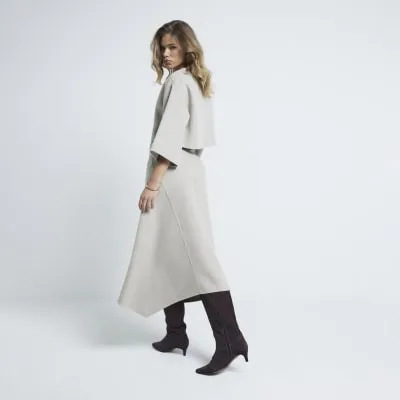 Beige wool blend asymmetric midi skirt sold by River Island