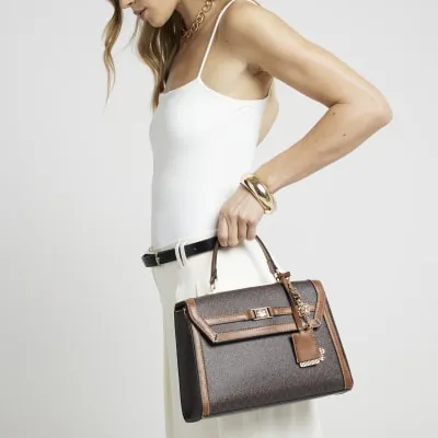 Brown monogram cross body top handle bag sold by River Island