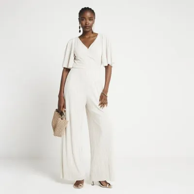 Cream plisse wide leg jumpsuit sold by River Island