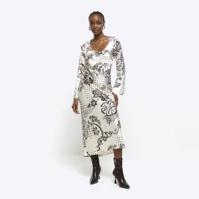 Cream satin floral belted slip midi dress sold by River Island
