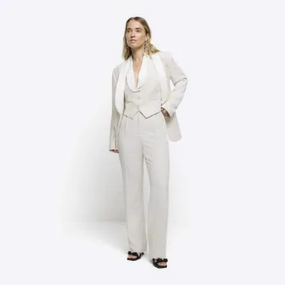 Cream crop tux waistcoat sold by River Island