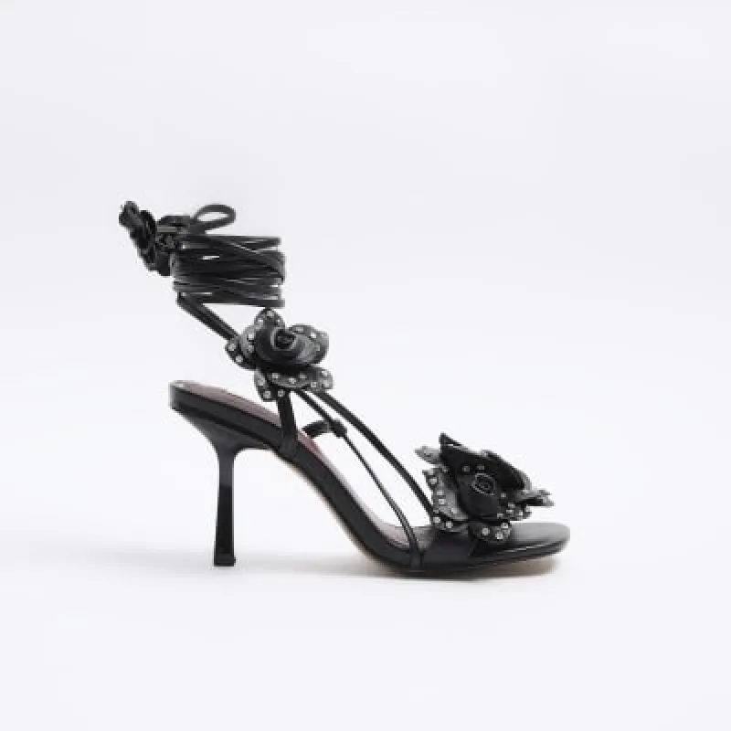 Black flower detail heeled sandals sold by River Island