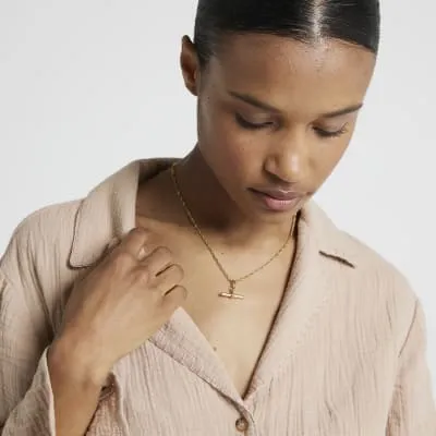 Gold Stainless Steel T bar Necklace sold by River Island