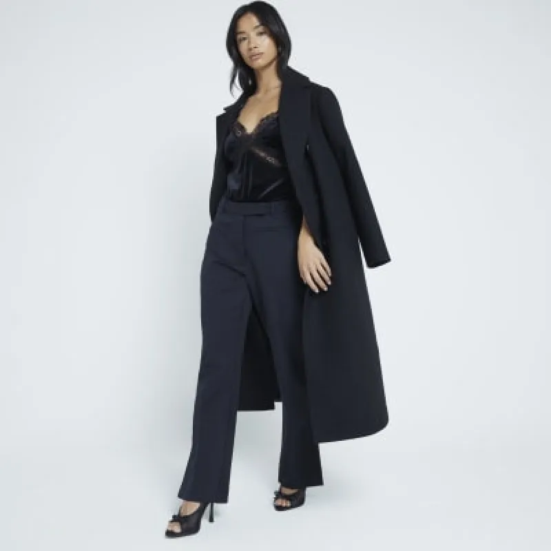Petite Black Slim Fit Tailored Flare Trousers sold by River Island