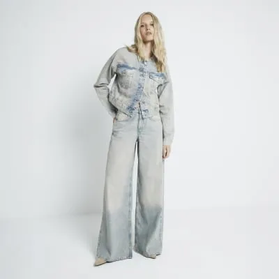 Grey mid rise faded wide leg jeans sold by River Island