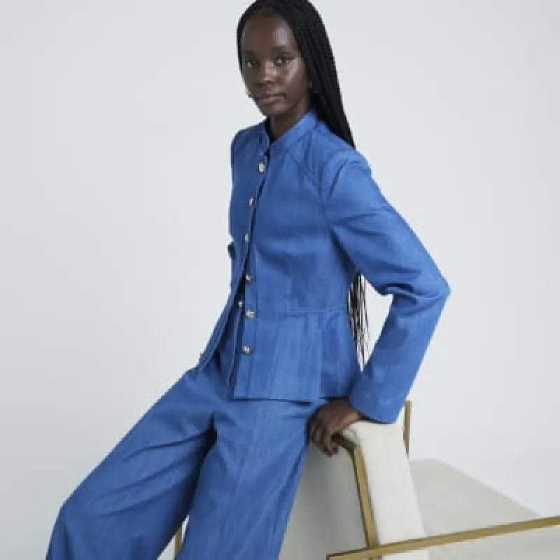 Blue peplum denim jacket sold by River Island