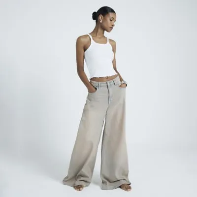 White lettuce hem vest top sold by River Island