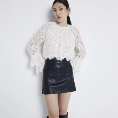 Black faux leather pocket mini skirt sold by River Island