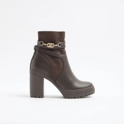 Brown hardware strap heeled boots sold by River Island