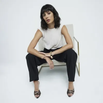 Black plisse top wide leg jumpsuit sold by River Island