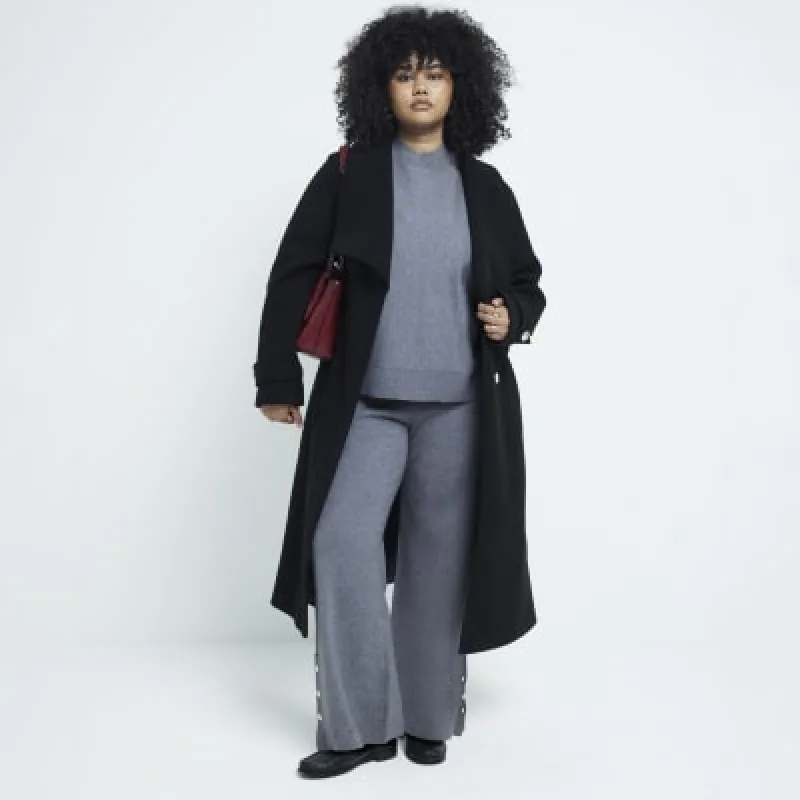 Plus black belted wrap coat sold by River Island