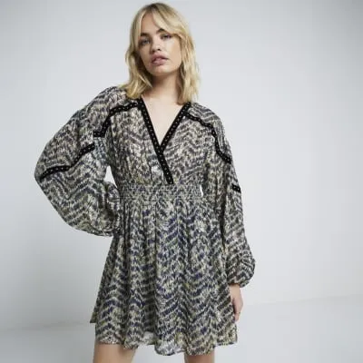 Green geometric long sleeve smock mini dress sold by River Island