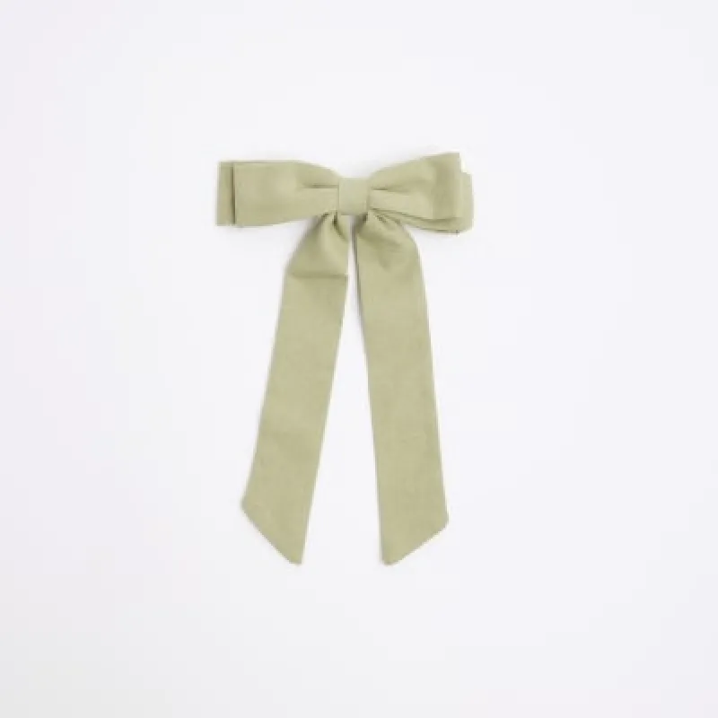 Green linen bow hair clip sold by River Island