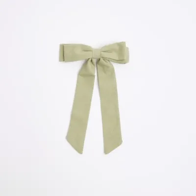 Green linen bow hair clip sold by River Island