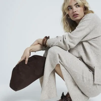 Brown suedette clutch bag sold by River Island