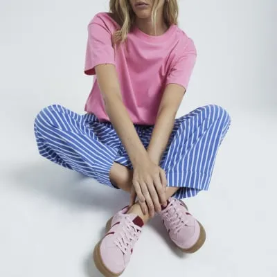 Pink suede lace up trainers sold by River Island