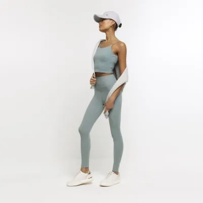Green high waisted leggings sold by River Island