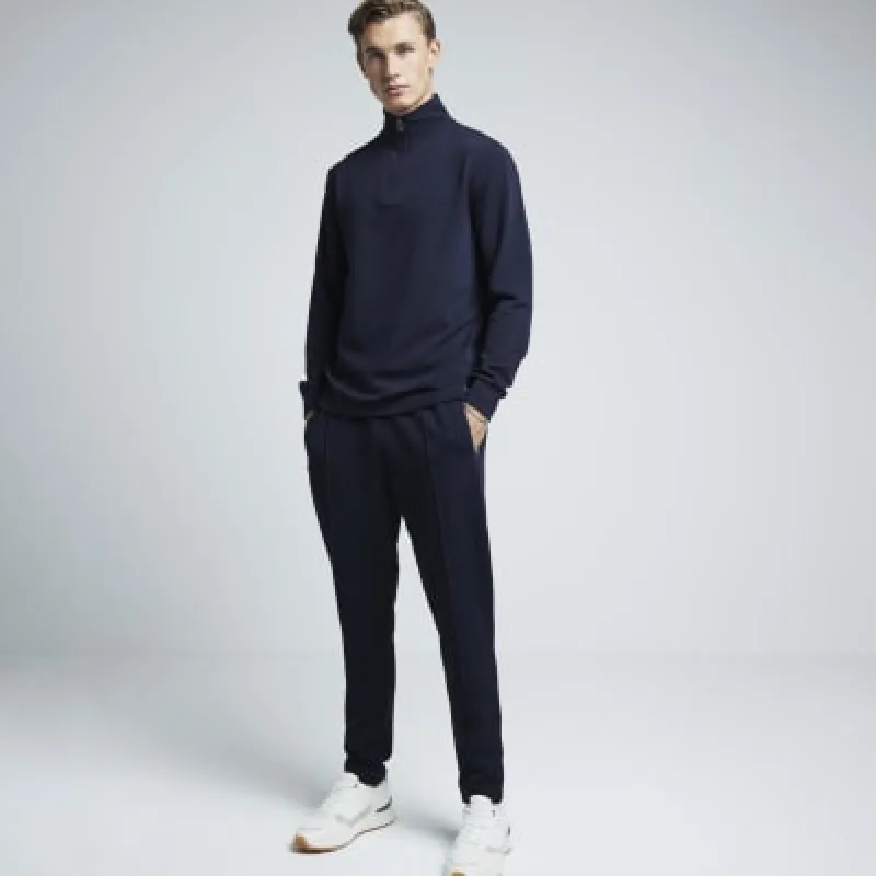 Navy slim fit stretch textured smart joggers sold by River Island