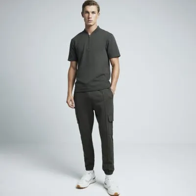 Khaki slim fit textured half zip polo sold by River Island