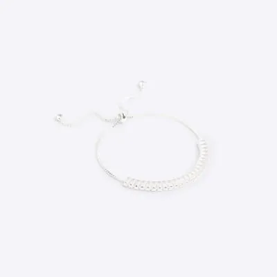 Silver colour textured bracelet sold by River Island