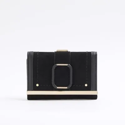 Black suedette buckle purse sold by River Island