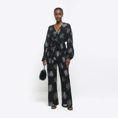 Black glitter floral belted jumpsuit sold by River Island