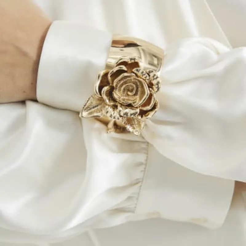 Gold Metal Flower Cuff Bracelet sold by River Island