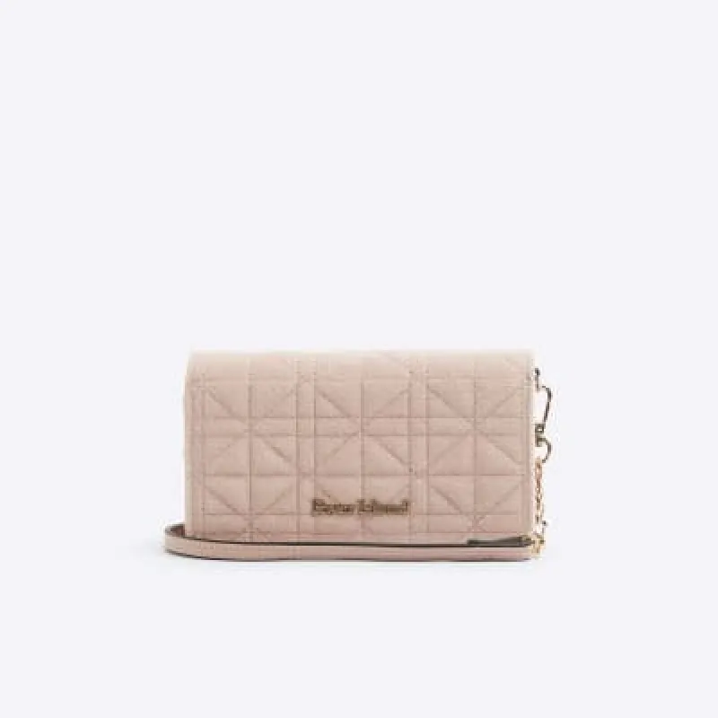 Pink faux wool quilted cross body purse sold by River Island
