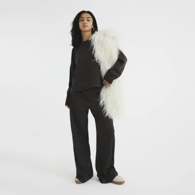 Petite Brown Wide Leg Trousers sold by River Island