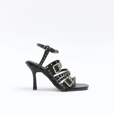 Black buckle heeled sandals sold by River Island
