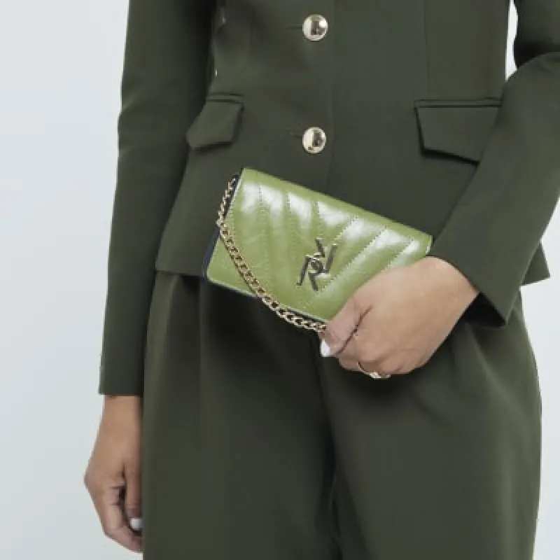 Green quilted chain strap cross body purse sold by River Island