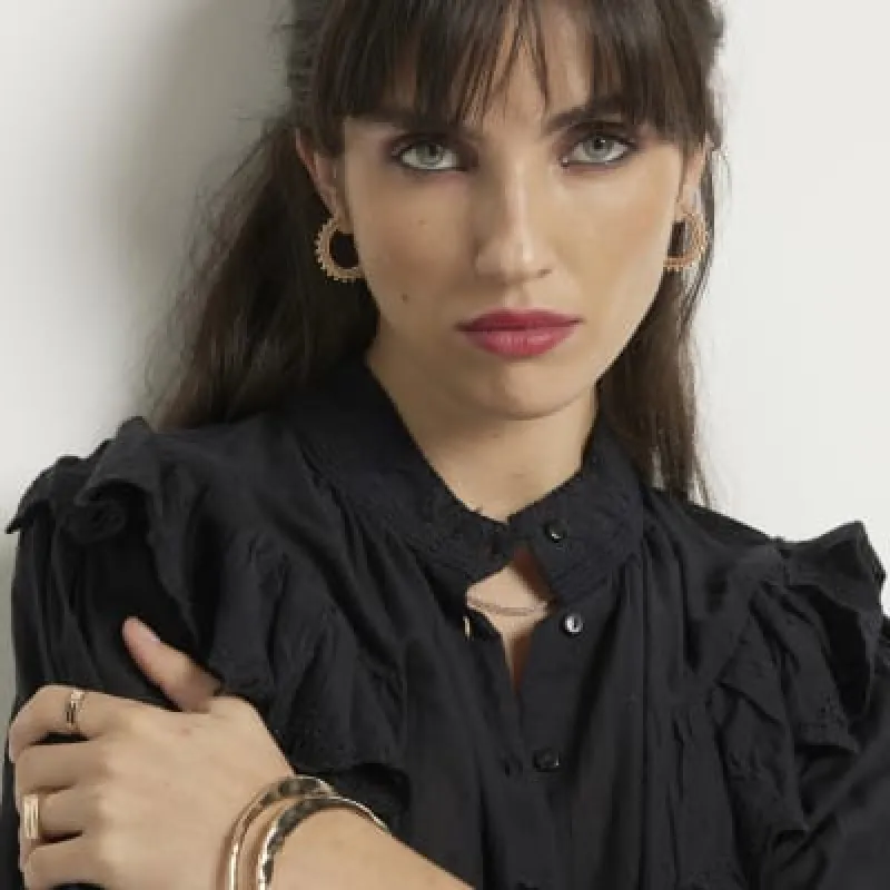 Black frill broderie blouse sold by River Island