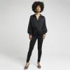 Black satin front knot blouse sold by River Island