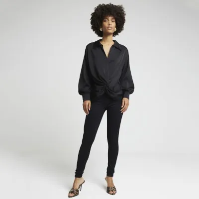 Black satin front knot blouse sold by River Island