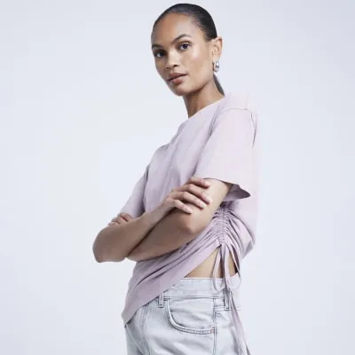 Pink washed ruched side t-shirt sold by River Island