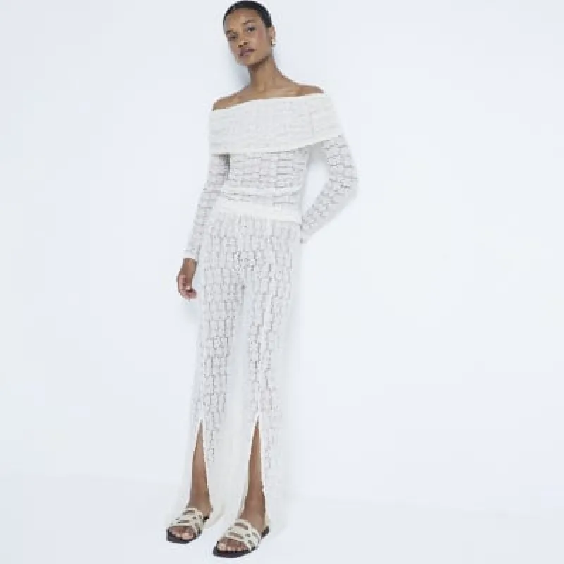 Cream lace bardot top sold by River Island