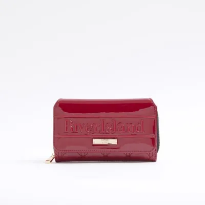 Red embossed quilted purse sold by River Island