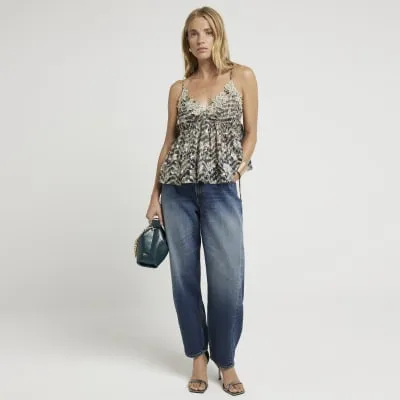 Green embellished floral cami top sold by River Island