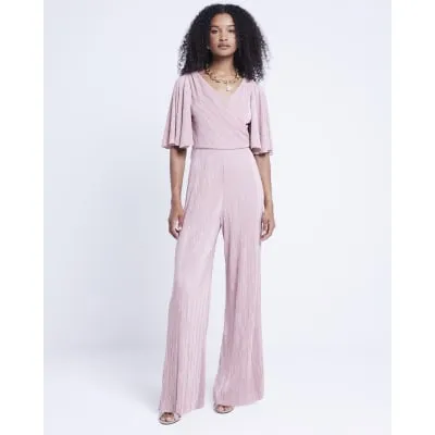 Pink plisse flute sleeve jumpsuit sold by River Island