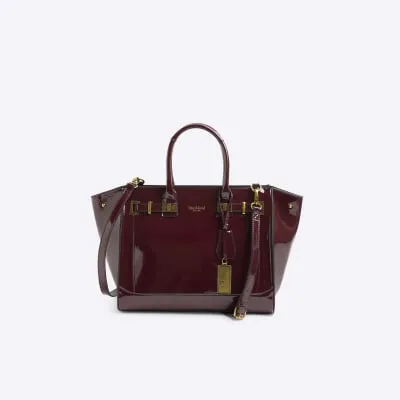 Red patent hardware tote bag sold by River Island