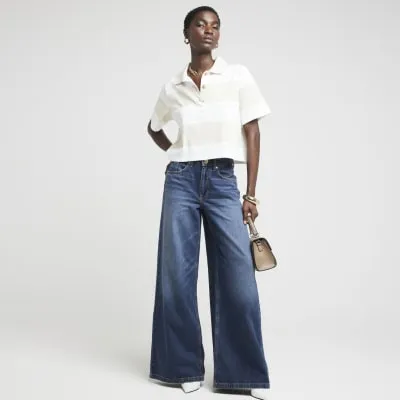 Blue mid rise wide leg elasticated jeans sold by River Island