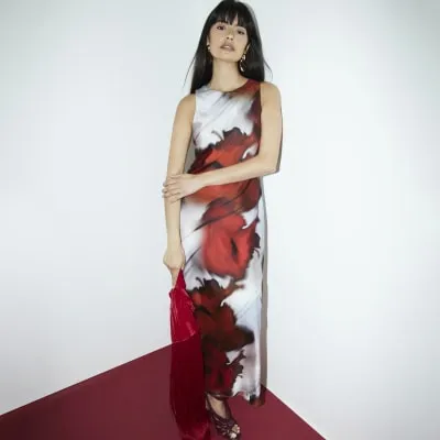 Red abstract print belted slip dress sold by River Island