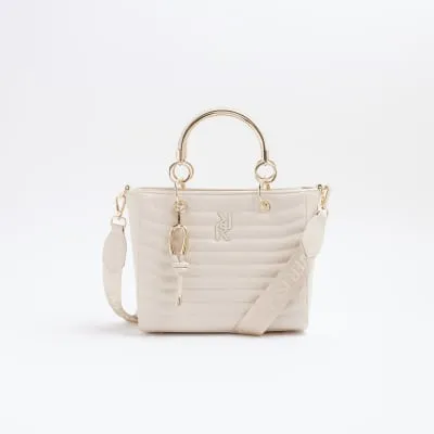 Cream quilted tote bag sold by River Island